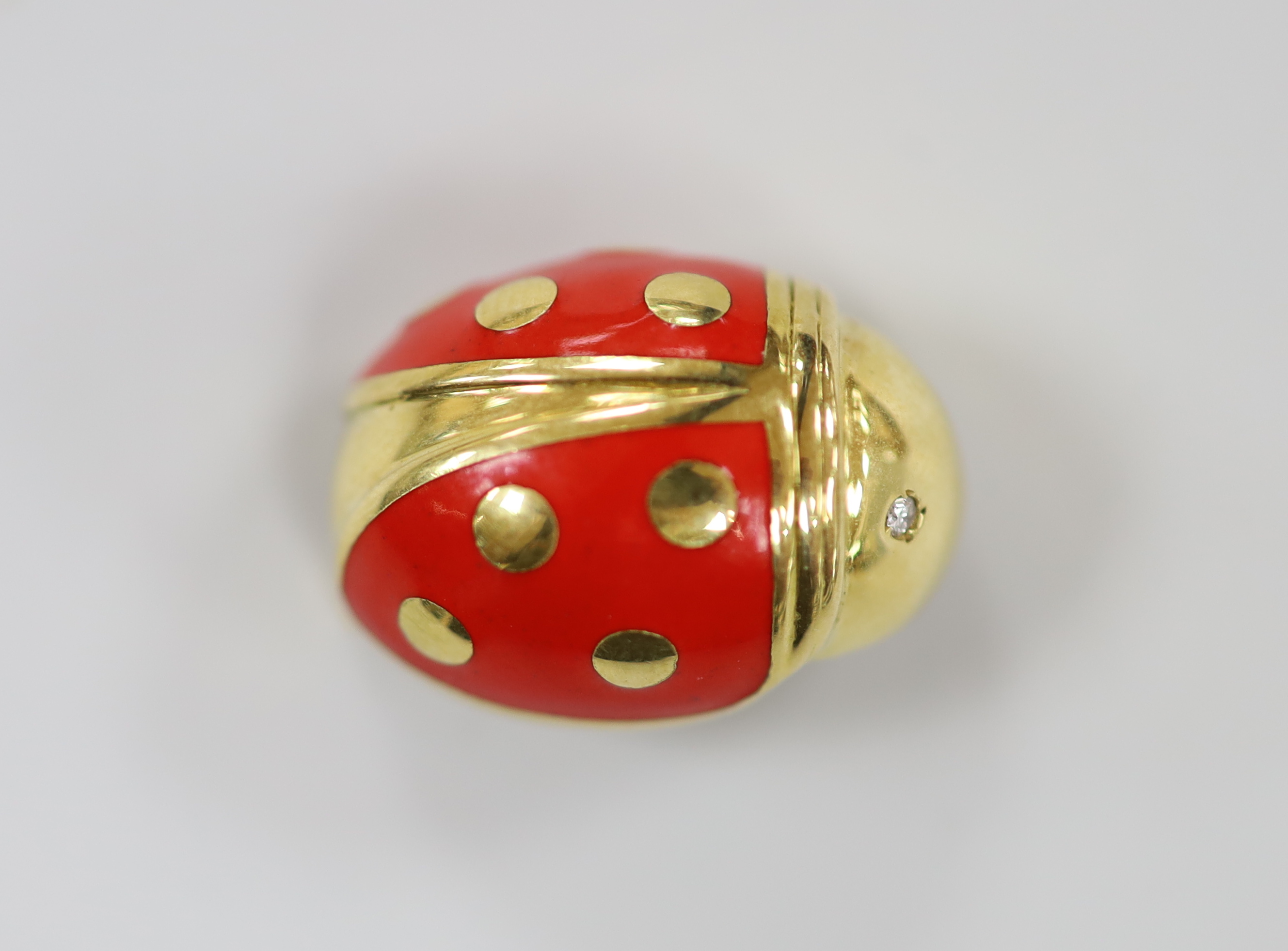 An 18ct gold, enamel and diamond chip set novelty clip brooch, in the form of a ladybird, by Mappin & Webb?, 20mm, gross weight 7.5 grams.